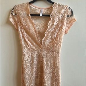 Tight plunge neckline dress with mesh back